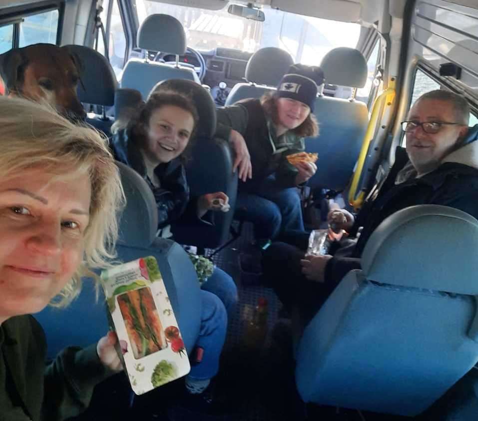 Sharing a bite to eat inside the minibus. Picture: Francis Wildman
