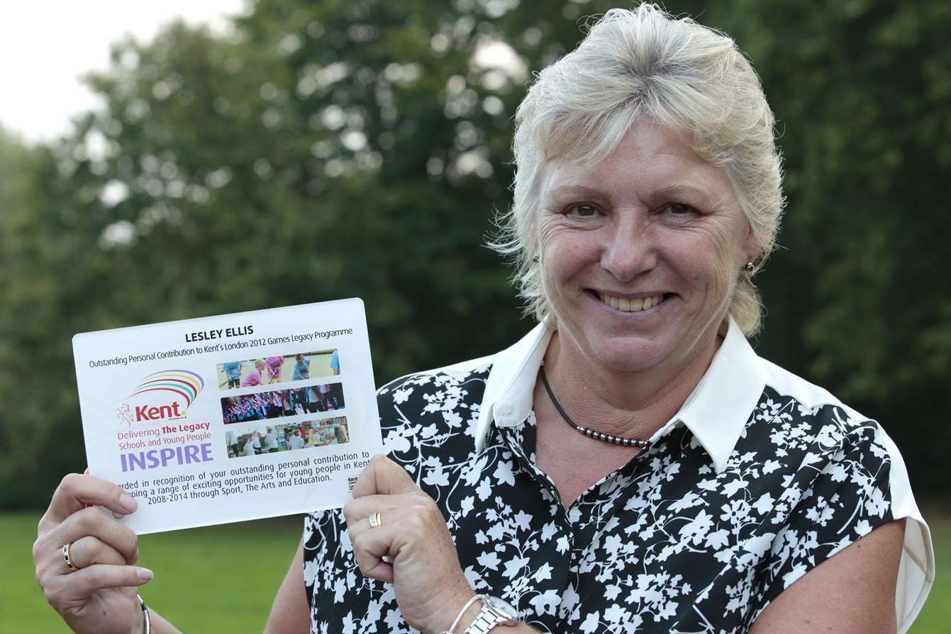 Former head teacher Lesley Ellis with her award. Picture: Martin Apps