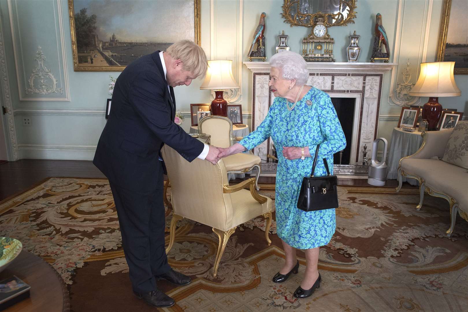 Boris Johnson bows during his audience with the Queen (Victoria Jones/PA)
