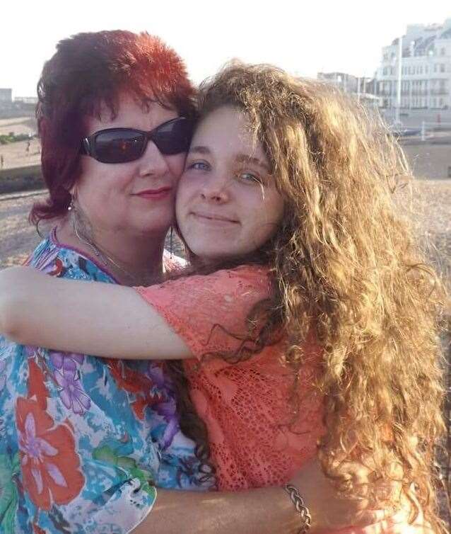 Before the cancer: Kelly as a younger child with her mum