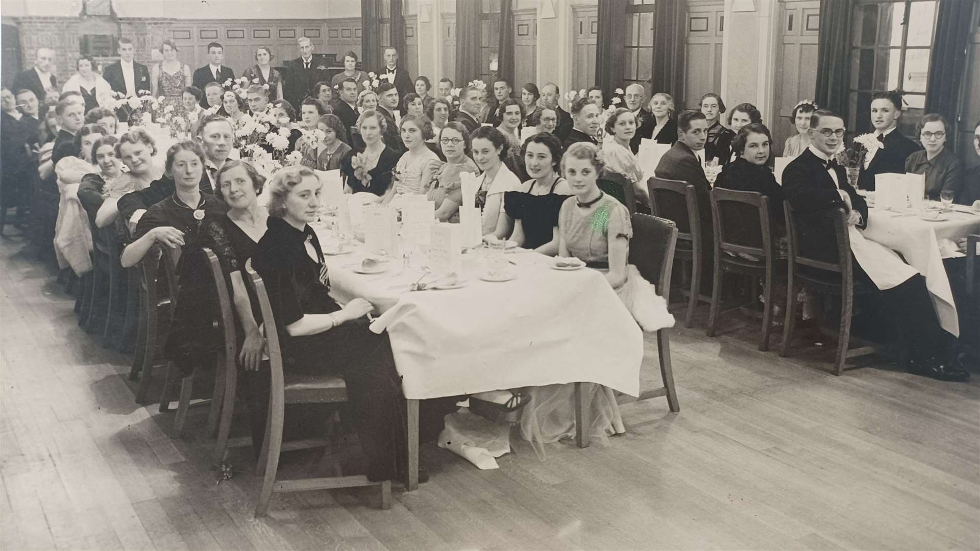 Penguins Suits in Chatham is closing. Employees at a sports and social club dinner in November 1938