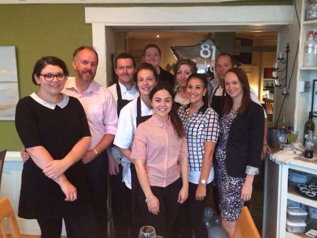 Some of the staff at the 81 Beach Street Restaurant celebrating 10 years in business