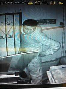 One of the people who broke into the parade of shops caught on the Kent Tattoo's CCTV in Dartford.