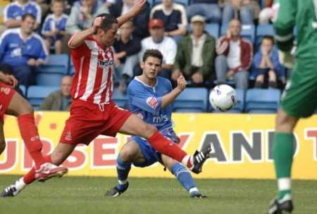 Matt Jarvis, who scored Gillingham's first goal, gets a shot in. Picture: GRANT FALVEY
