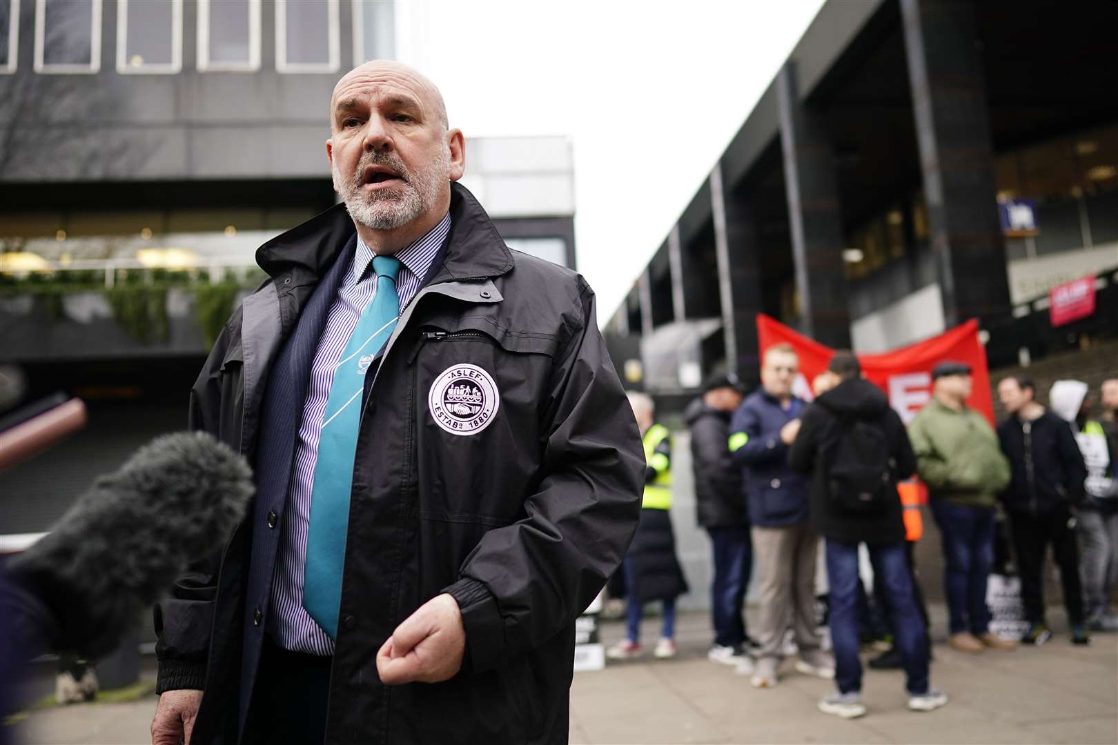 Aslef leader Mick Whelan speaks to the media on the picket line at London Euston station on Thursday (Aaron Chown/PA)