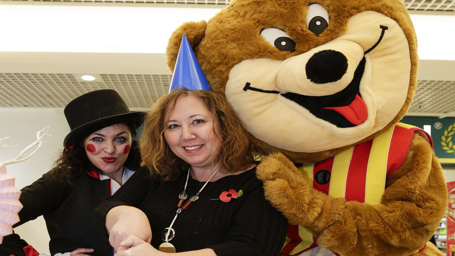Sammy Benn, Shelley Filippi (centre manager), and Party Bear. Priory Shopping Centre celebrates its 40th birthday