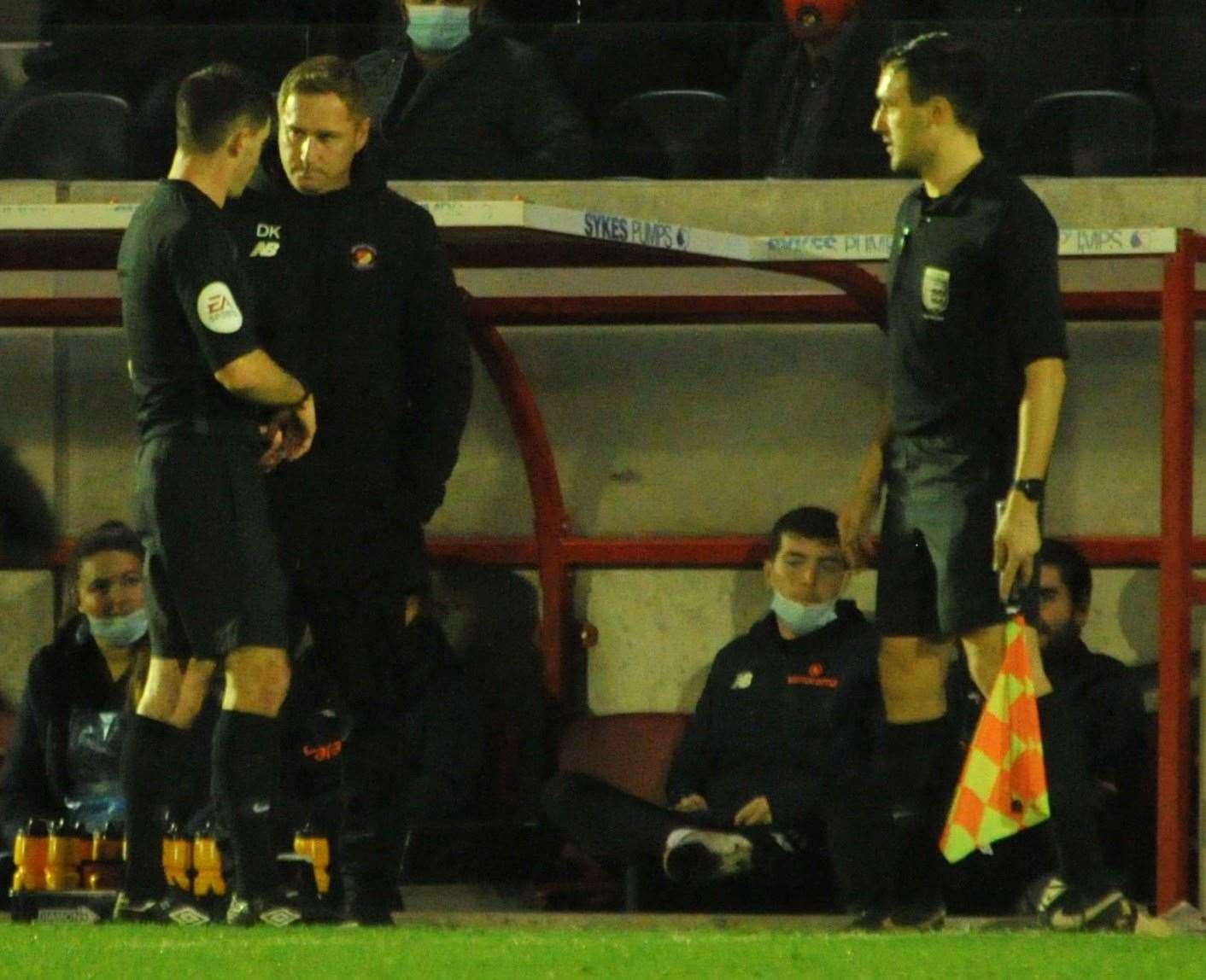 Referee Isaac Searle has words with Ebbsfleet boss Dennis Kutrieb Picture: Steve Terrell