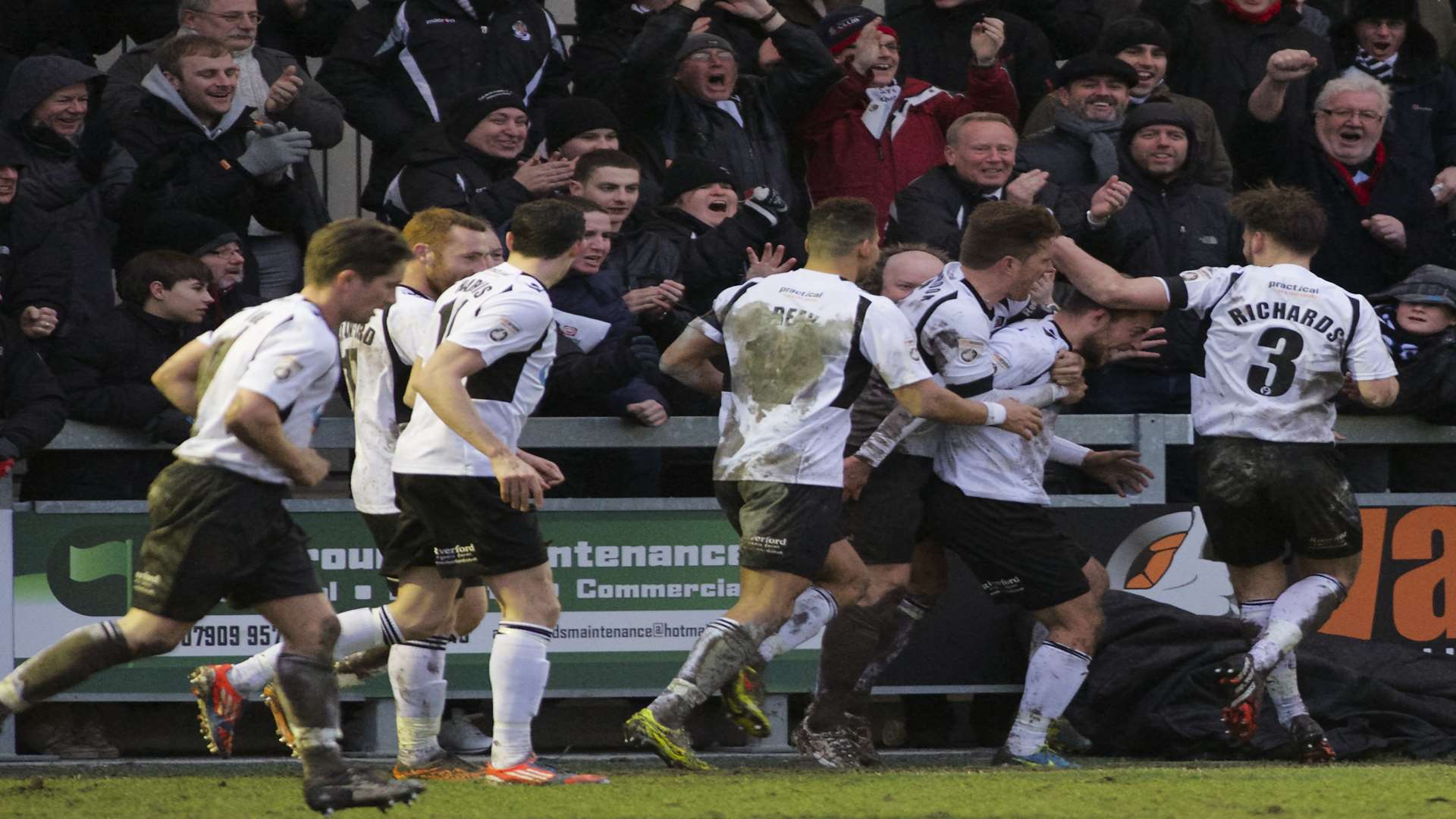 Ryan Hayes is mobbed by his Dartford team-mates after scoring to make it 2-2 Picture: Andy Payton