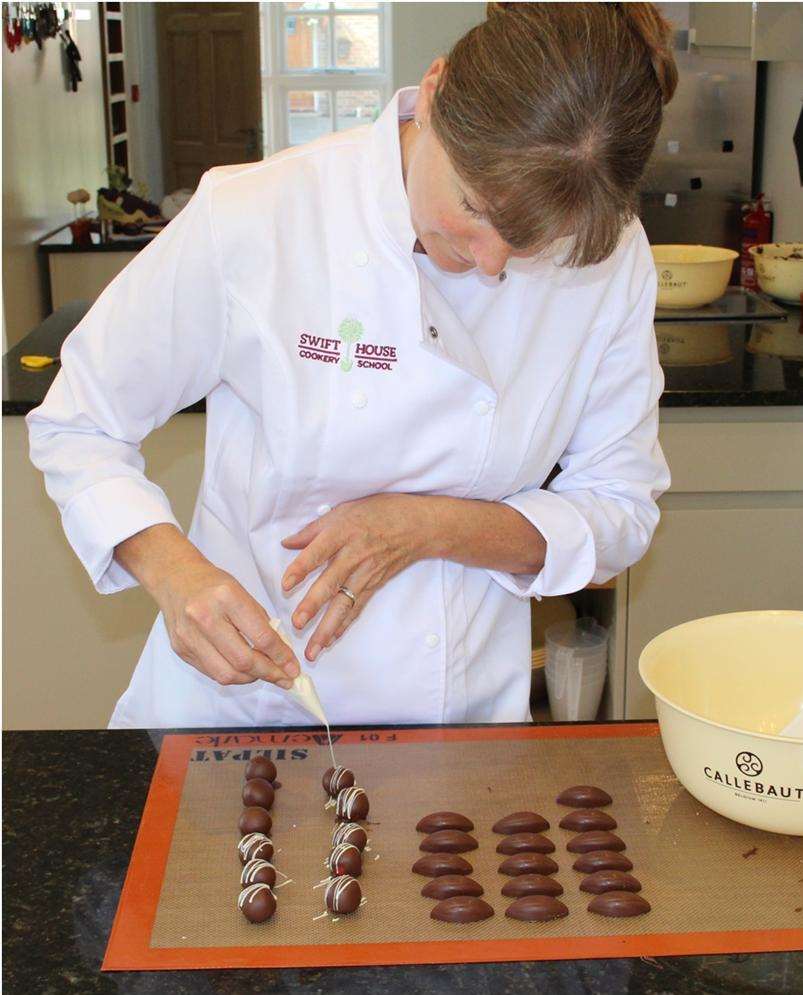 Caroline Phillips, designer of the devil cake for Dev Biswal of The Ambrette restaurant, Margate, in action on another speciaility: crafting handmade chocolates