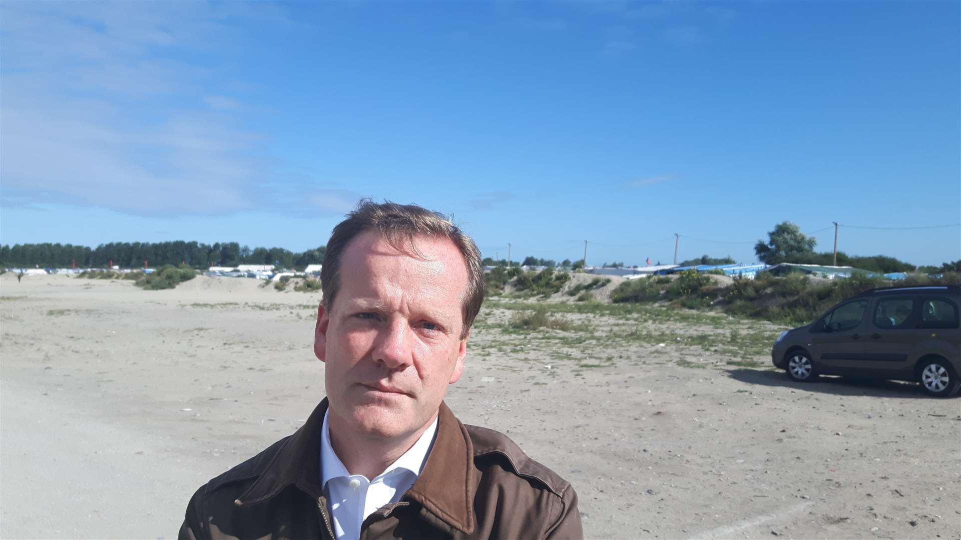 Charlie Elphicke outside the Jungle camp a month before its closure in 2016