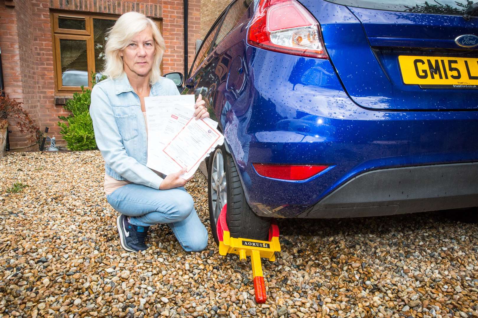 Teresa Newman of Eynsford Road, Crockenhill, who suffers with a severe heart condition, has had her car clamped for not paying a dart charge bill despite already paying.Picture: Matthew Walker (3570176)