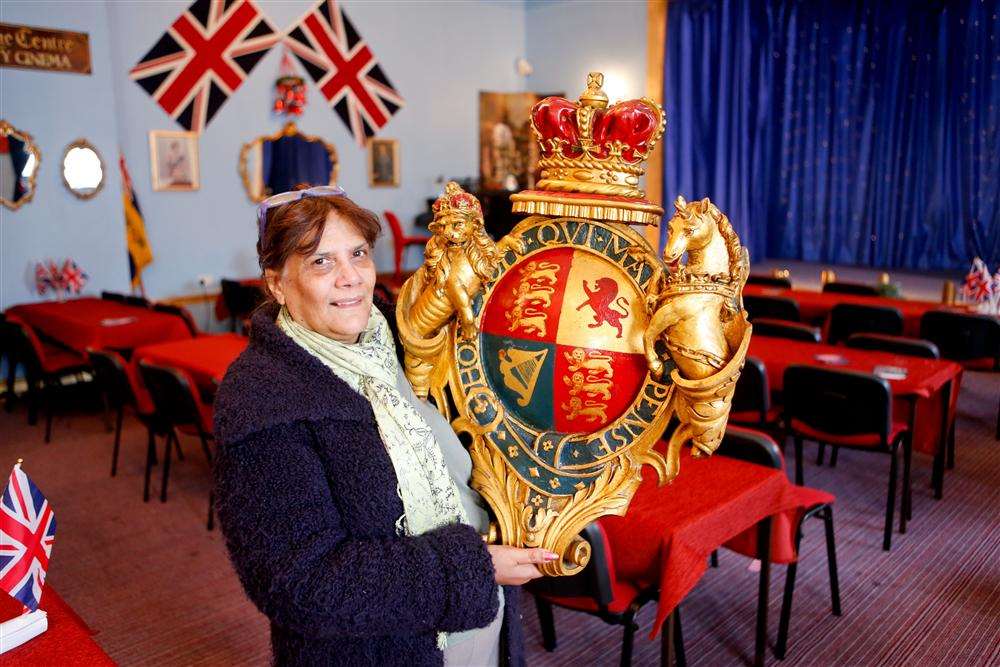 Jenny Hurkett, founder and director of the Blue Town Heritage Centre, with the coat of arms which used to be at the old court house in Blue Town