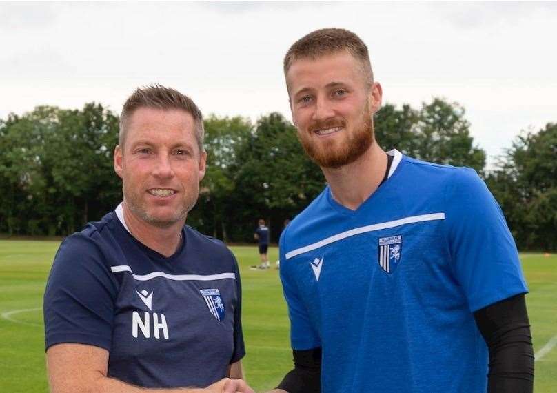Gillingham manager Neil Harris with new goalkeeper signing Jake Turner Picture: GFC (57680294)