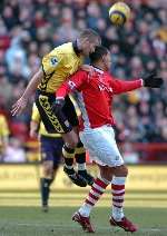 Villa's Olof Mellberg climbs above Jay Bothroyd to clear. Picture: MATTHEW WALKER