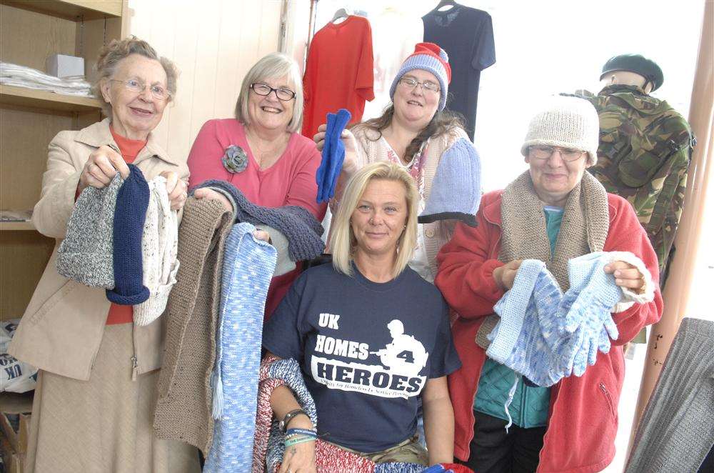 Ann Lowe, Anita Reeves, Debbie Rudge and Patricia Roberts of the Sheppey KnitWitz with Simone Dowse, Charity Director Kent of UK Homes for Heroes