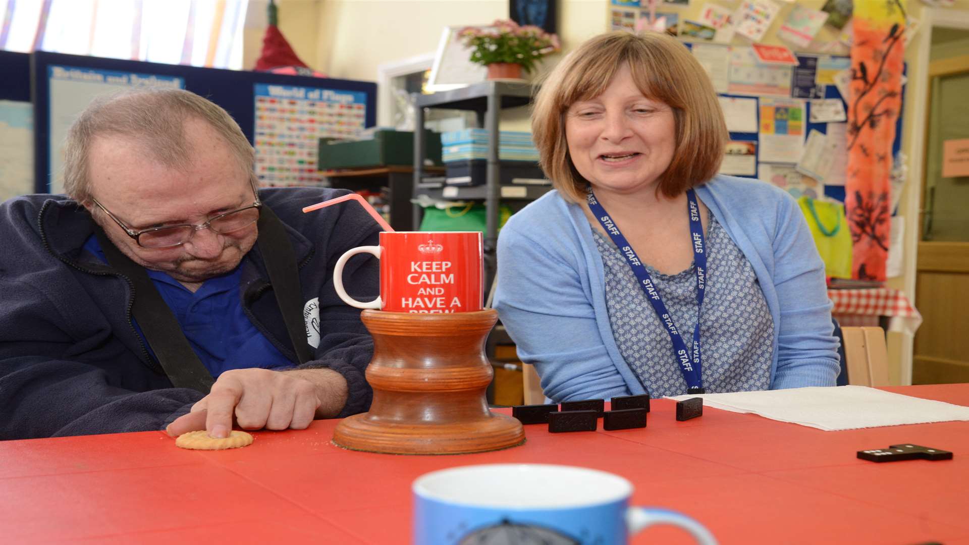 Day Centre facilitator Liz Hatfield and Colin Hindson enjoy a game of dominoes. Picture: Gary Browne