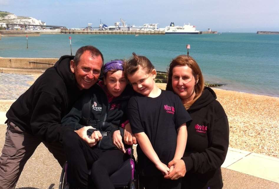 Natasha with her family after arriving in Dover