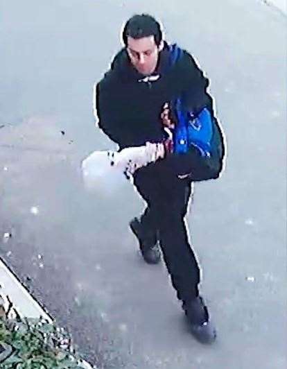 A CCTV image showing Wheeler in Roger's Close, not far from his home, carrying what is believed to be the murder weapon. Picture: Kent Police