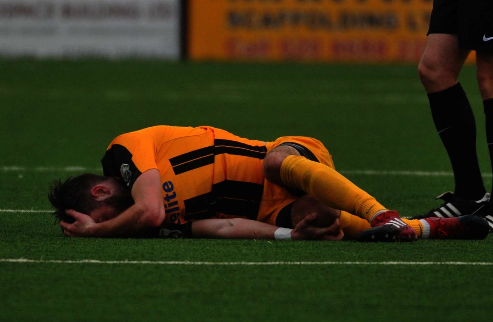 Ollie Muldoon suffers his knee injury at Bromley Picture: Steve Terrell