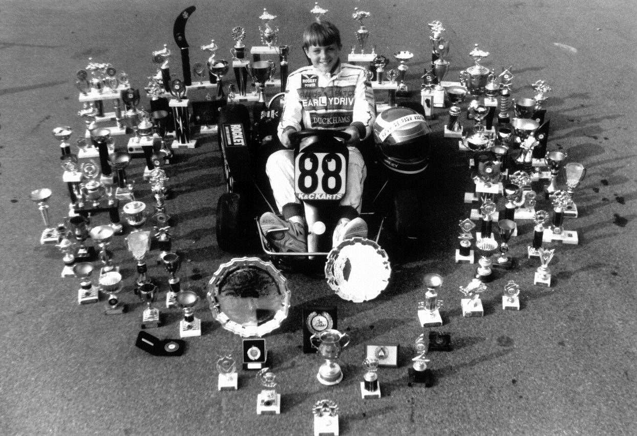 Eleven-year-old Tom Sisley, Bill's son, pictured with his many awards at Buckmore in 1992. Tom was Jenson Button's team-mate in European karting