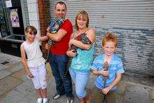 Jamie Pardoe and his family withtheir pet tegu lizards