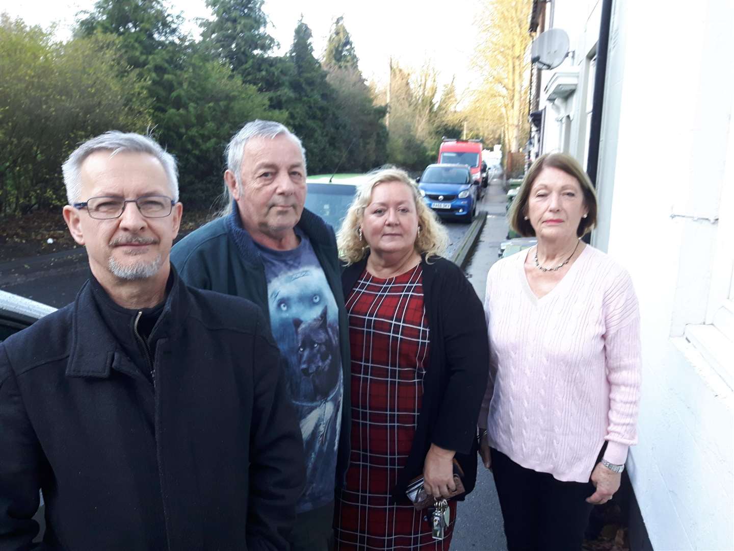 Gary Cook, Michael Ash, Rachele Verrier and Anna Gray outside their homes