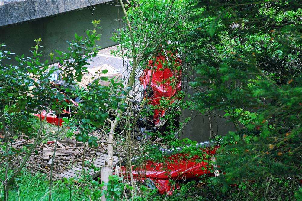Wreckage of the red lorry that hit a bridge on the A2