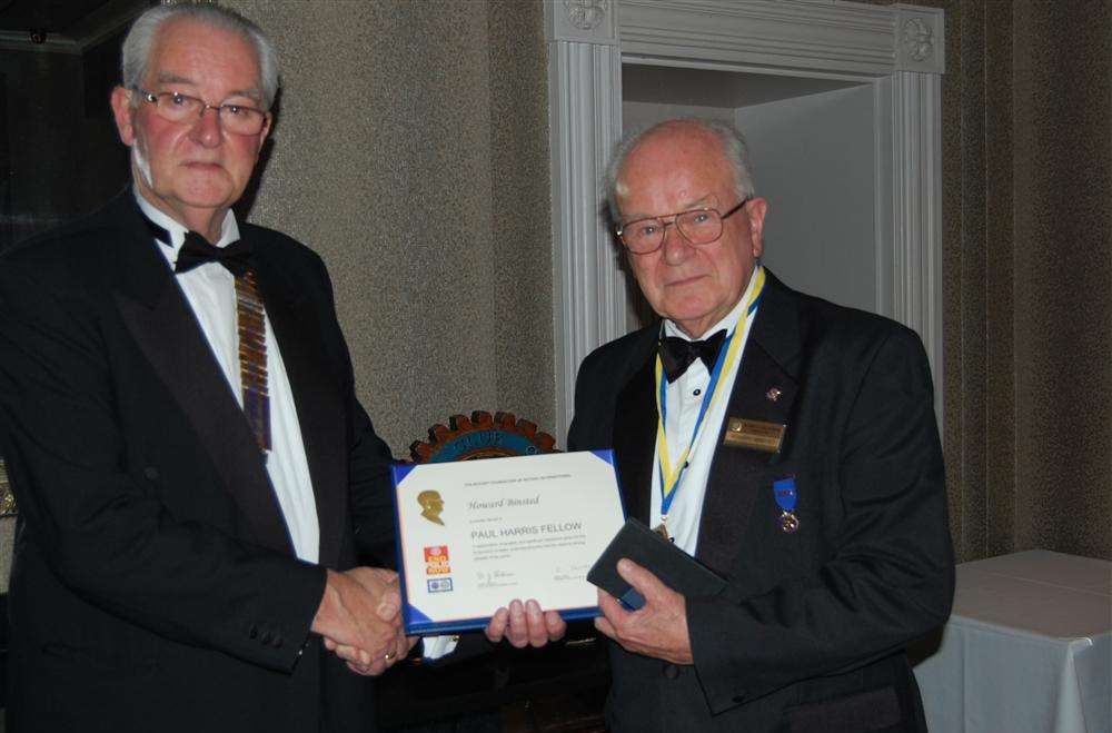 Deal Rotary president John Utting, left, presents the Paul Harris Fellowship to past president Howard Binsted