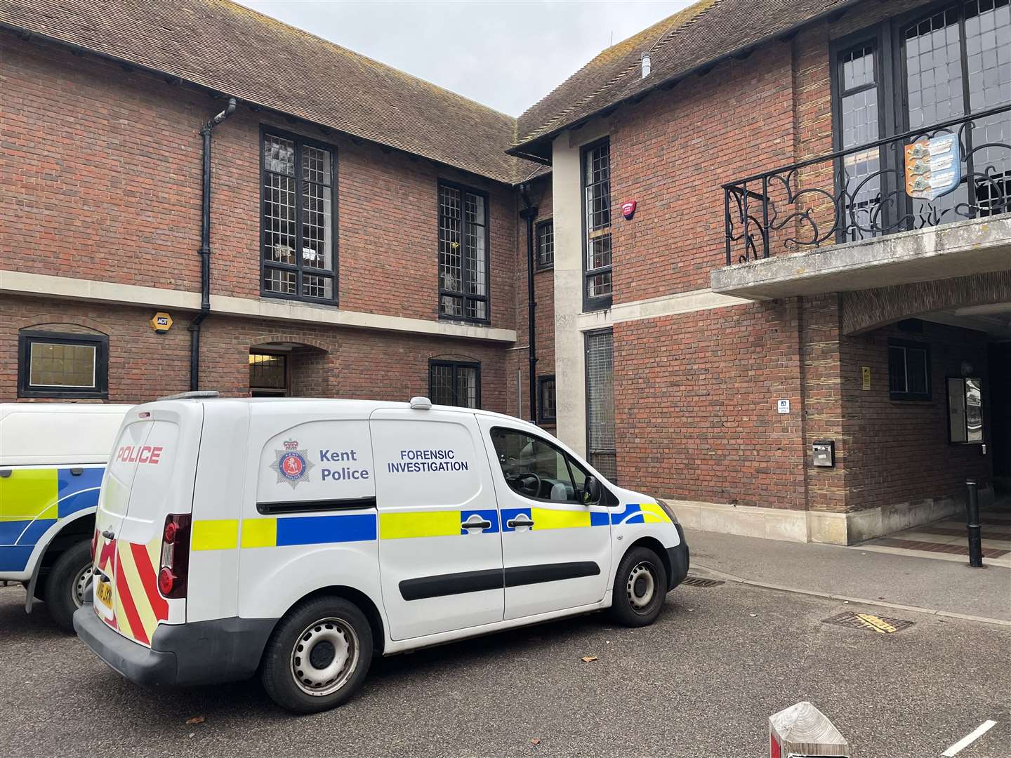 Two police vehicles pictured at Sandwich Guildhall after the attack