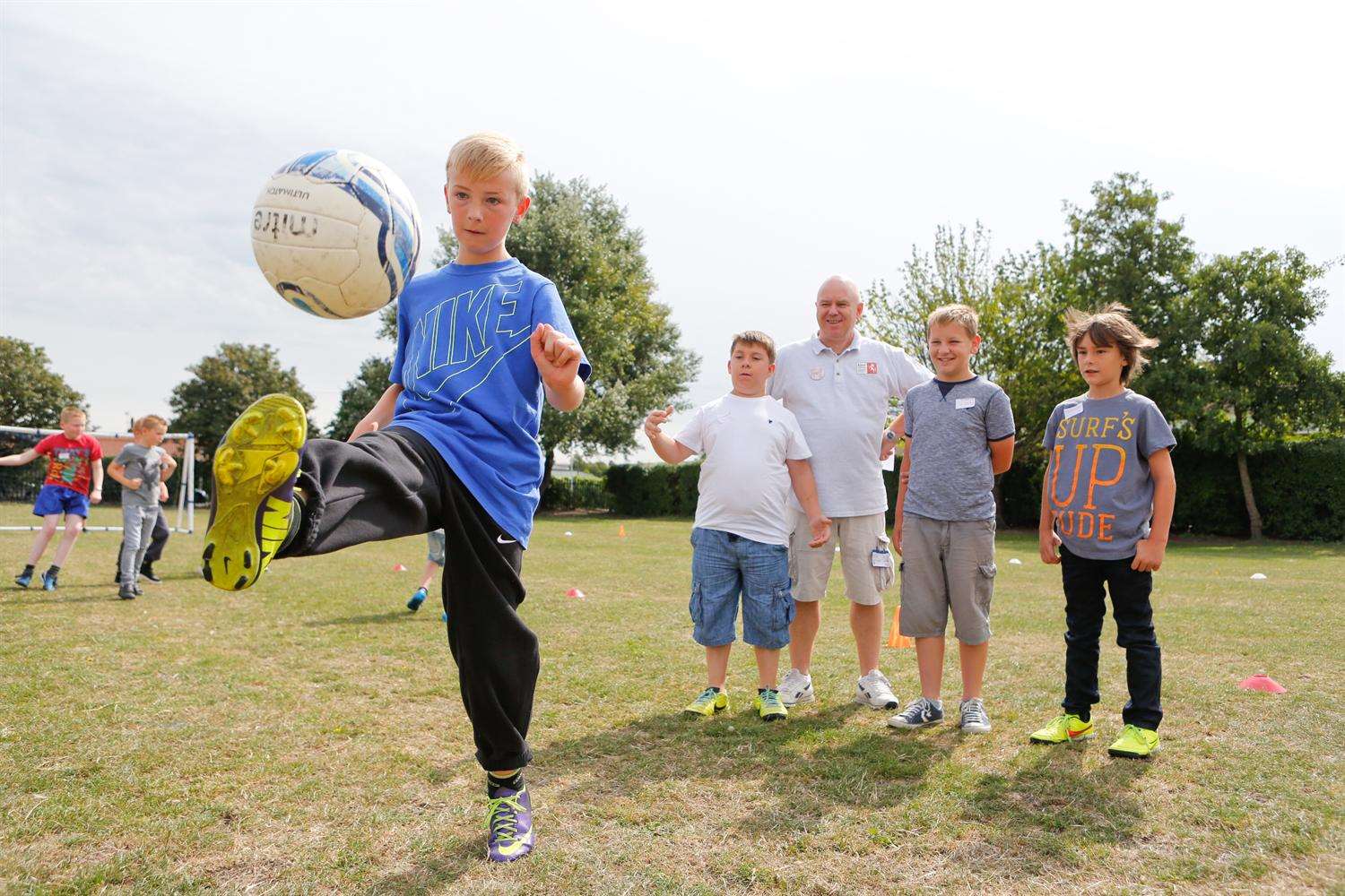 Conner Secker-Chandler, 11, keeps the ball up