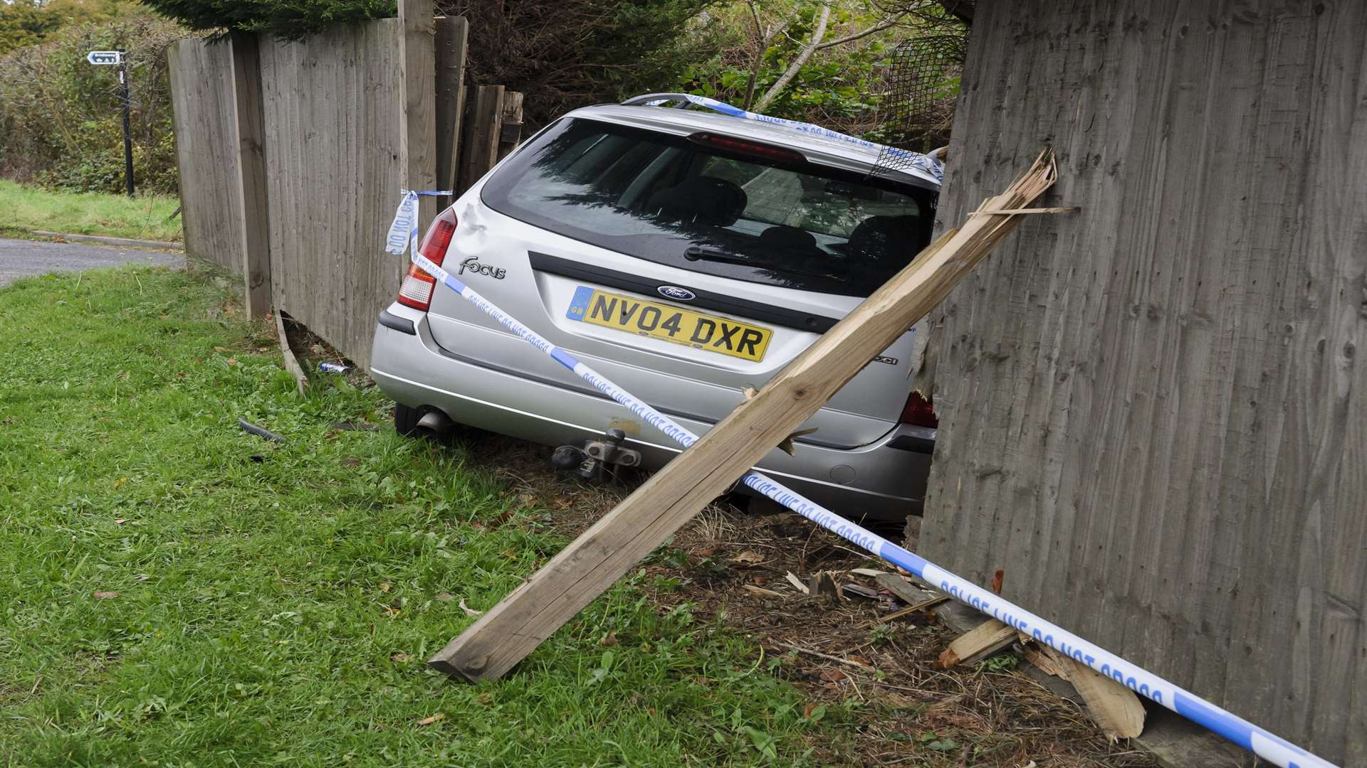 The car crashed through a garden fence