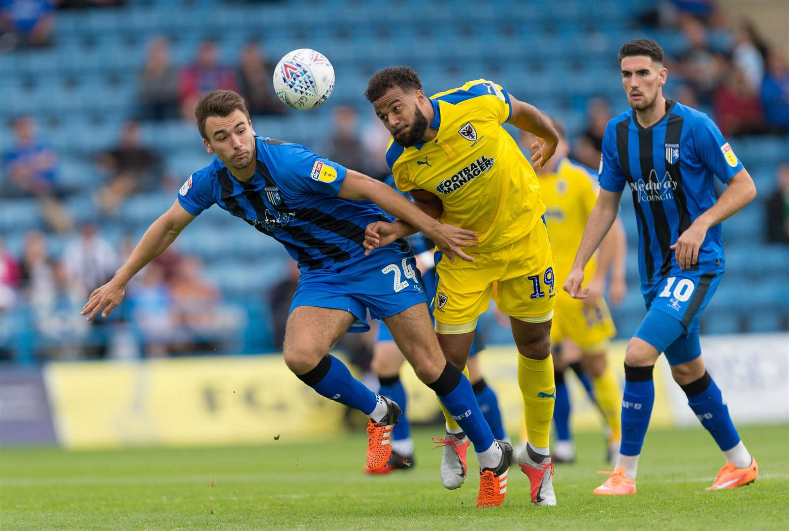 Josh Rees challenges with Tom Soares in Gillingham's game against AFC Wimbledon Picture: Ady Kerry