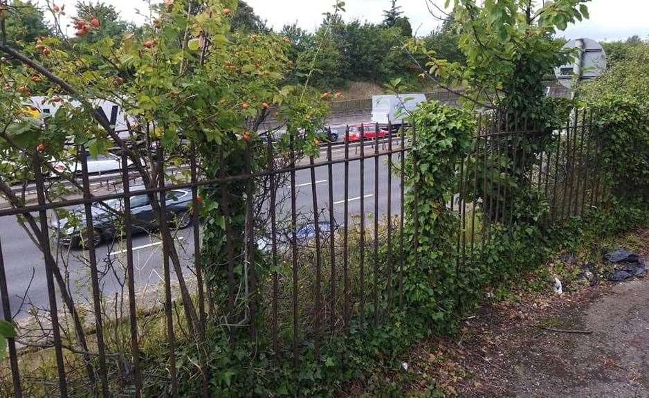 The railings in Brent Way overlooking the stretch of A282 on the approach to the Dartford Crossing