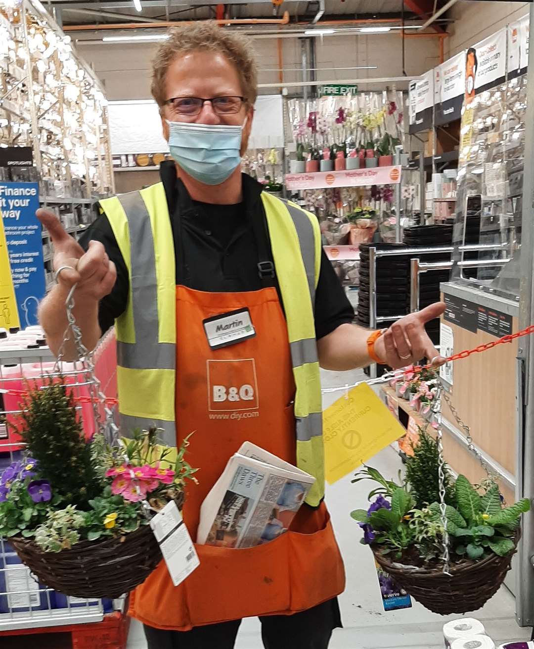 Manager of B&Q in Gravesend, Martin Foreman, donated two hanging baskets and plants for the waiting room to the home. Picture: Jenny Gibbons