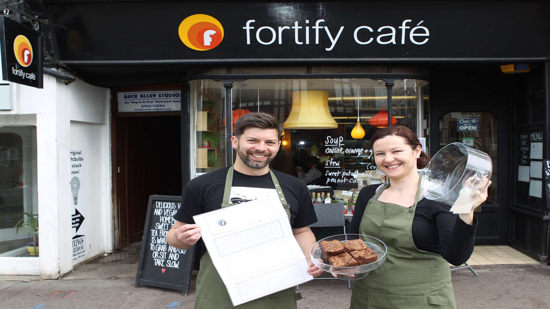 From left, James Hooper and Joanna Duda Cazas, front of house, celebrate receiving a Trip Advisor certificate of excellence outside Fortify Café