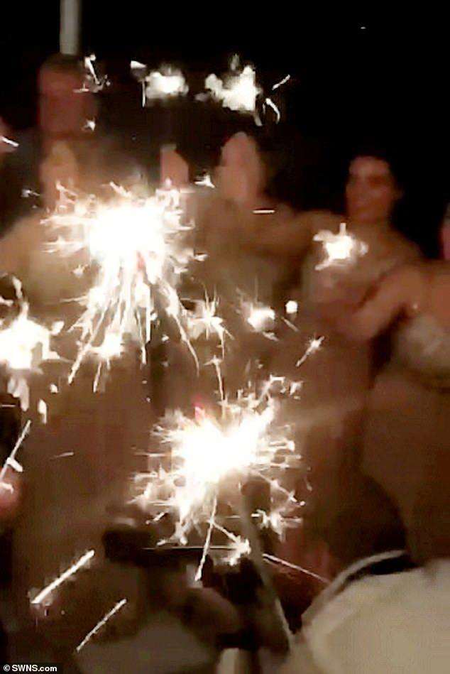 Sparklers at the wedding in Italy two months ago. Picture: SWNS