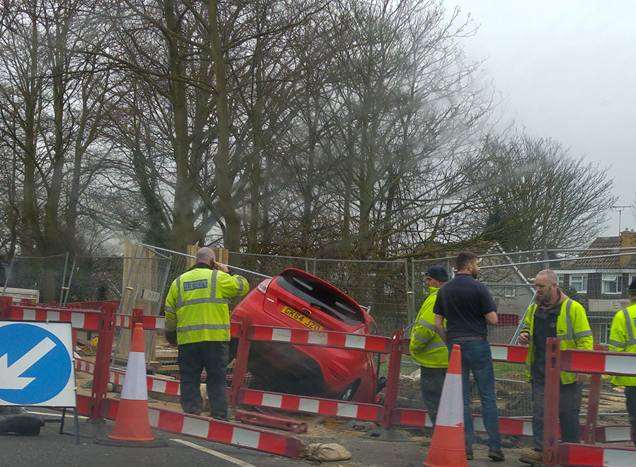 A car has crashed into roadworks on the A2 London Road near Wises Lane