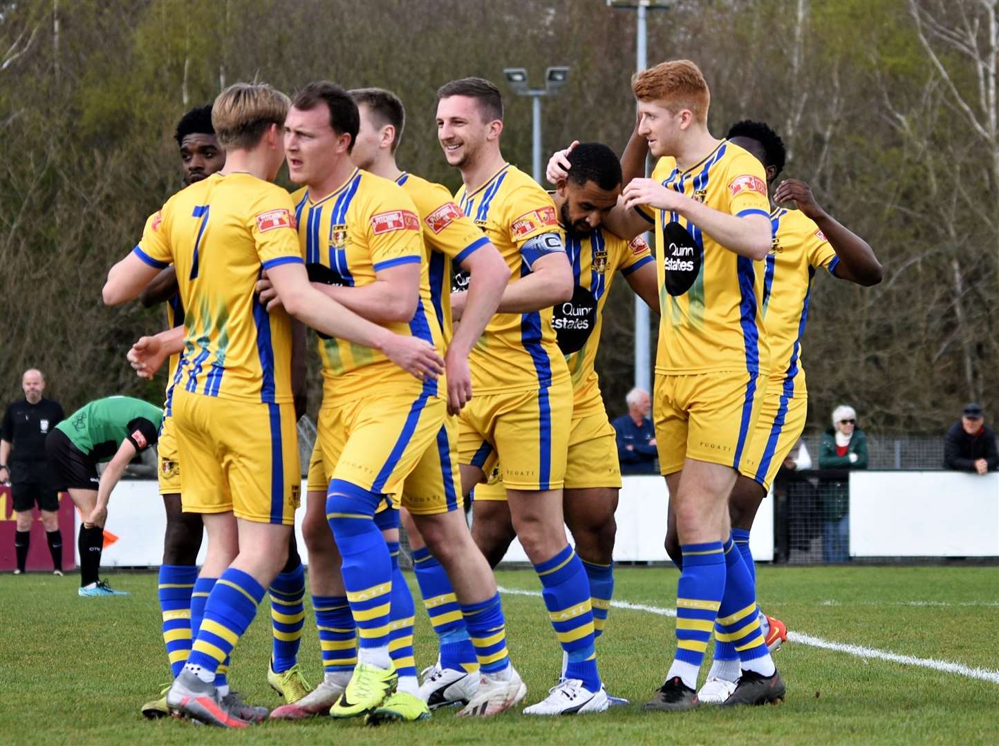 Sittingbourne forward Harry Stannard (No.7) is congratulated on his equaliser at Burgess Hill Picture: Ken Medwyn