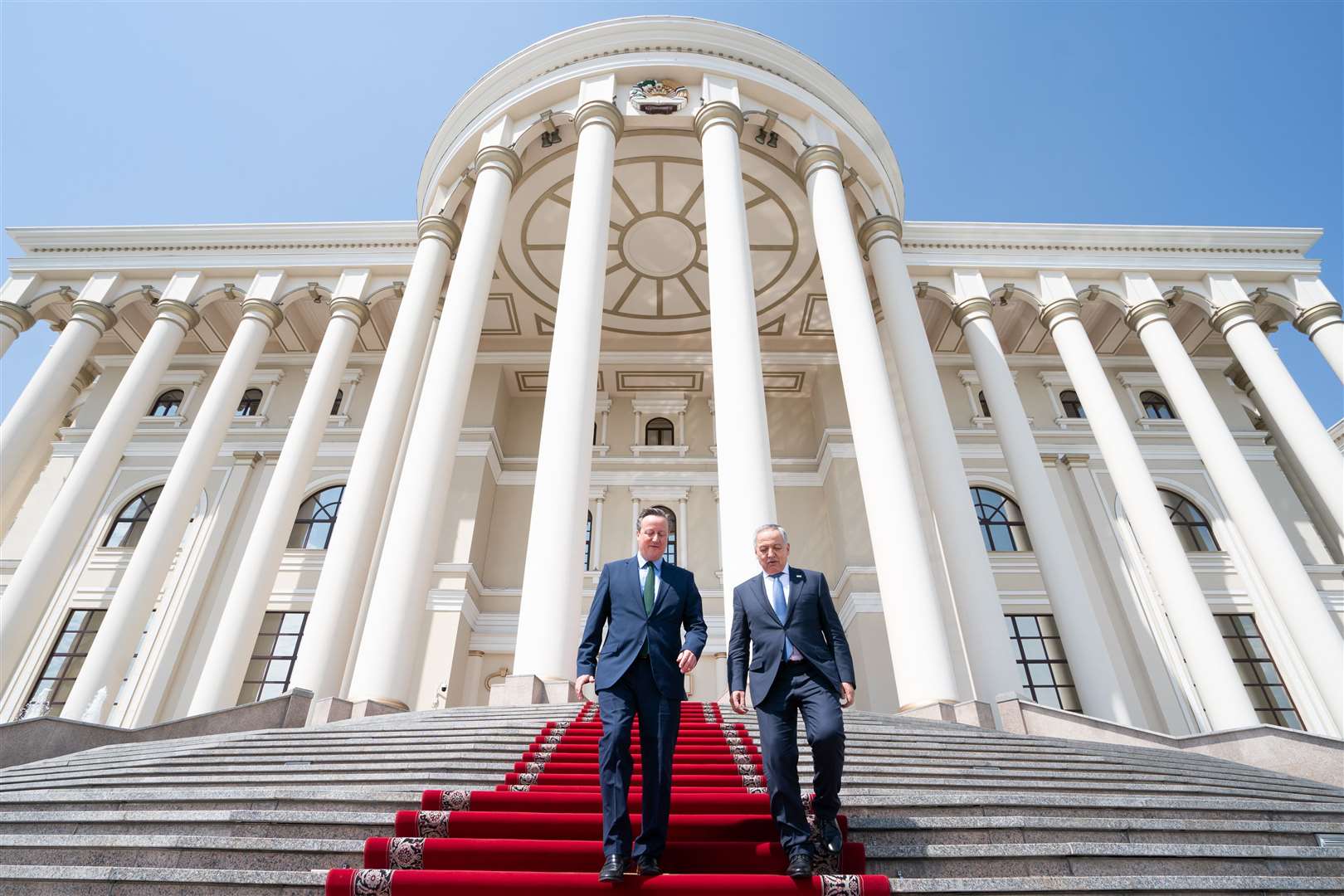 Lord Cameron leaves the Presidential Palace in Dushanbe with Tajik foreign minister Sirojiddin Muhriddin after meeting the president as he visits Tajikistan (Stefan Rousseau/PA)