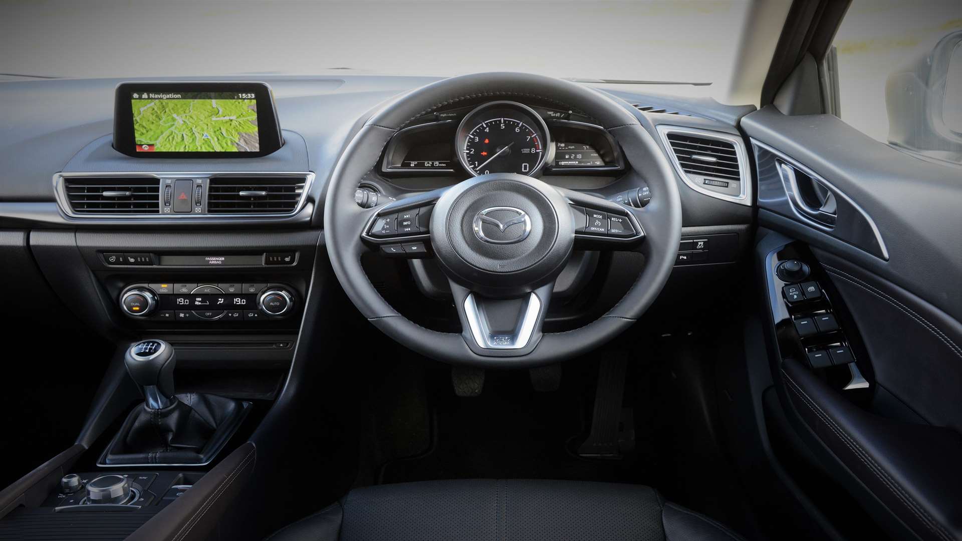 The roomy cockpit of the refreshed Mazda3