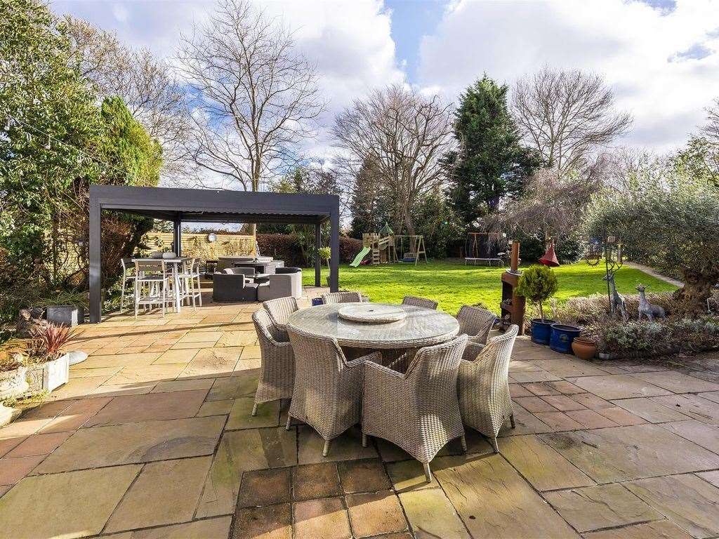 A blend of grass and paved areas makes for a versatile garden at the back of this high-price home. Photo: Zoopla