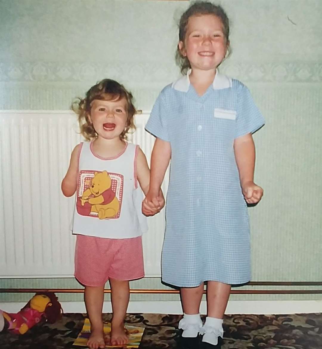 Abi with her older sister Tia as a child