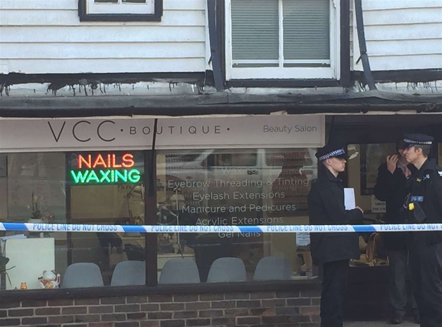 Police outside the nail bar in Tonbridge High Street following the attempted murder