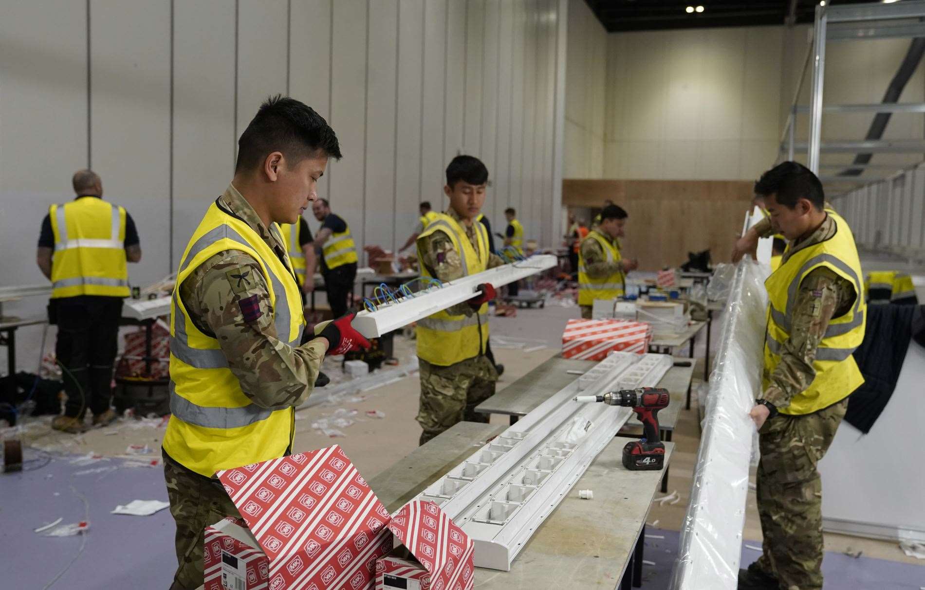 Members of the Queen’s Gurkha Engineer Regiment, 36 Engineer Regiment as they help build NHS Nightingale Hospital. Picture: Andrew Parsons / 10 Downing Street
