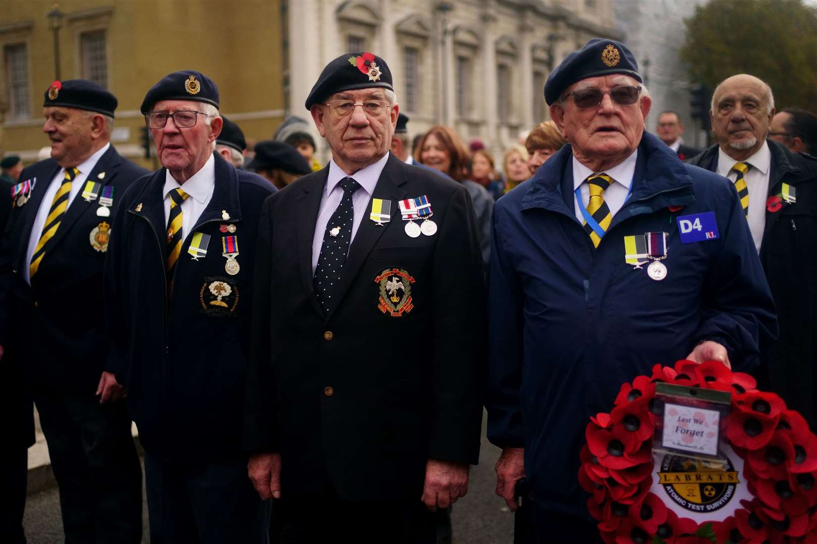 Nuclear test veterans wearing the “missing medal” at the Remembrance Sunday service at the Cenotaph (Victoria Jones/PA Wire)