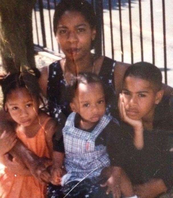 Murder victim Andre Bent pictured as a child (centre) with mother Monika, sister Michaela and brother Dominic