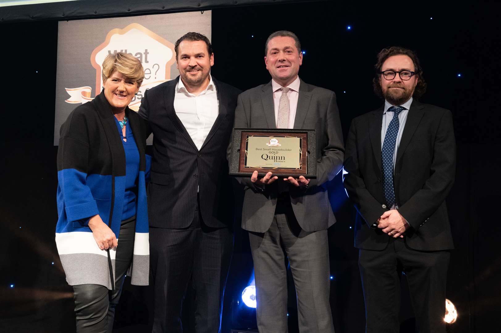 Quinn Homes boss Mark Quinn, second left, collects his award from Clare Balding, far left at the WhatHouse? Awards