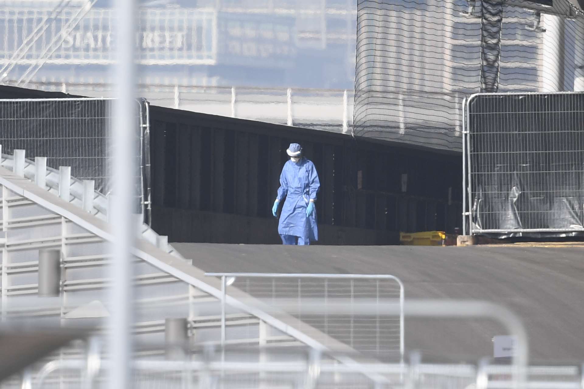 A medical worker in personal protective equipment outside the NHS Nightingale Hospital at the ExCel centre in London (PA)