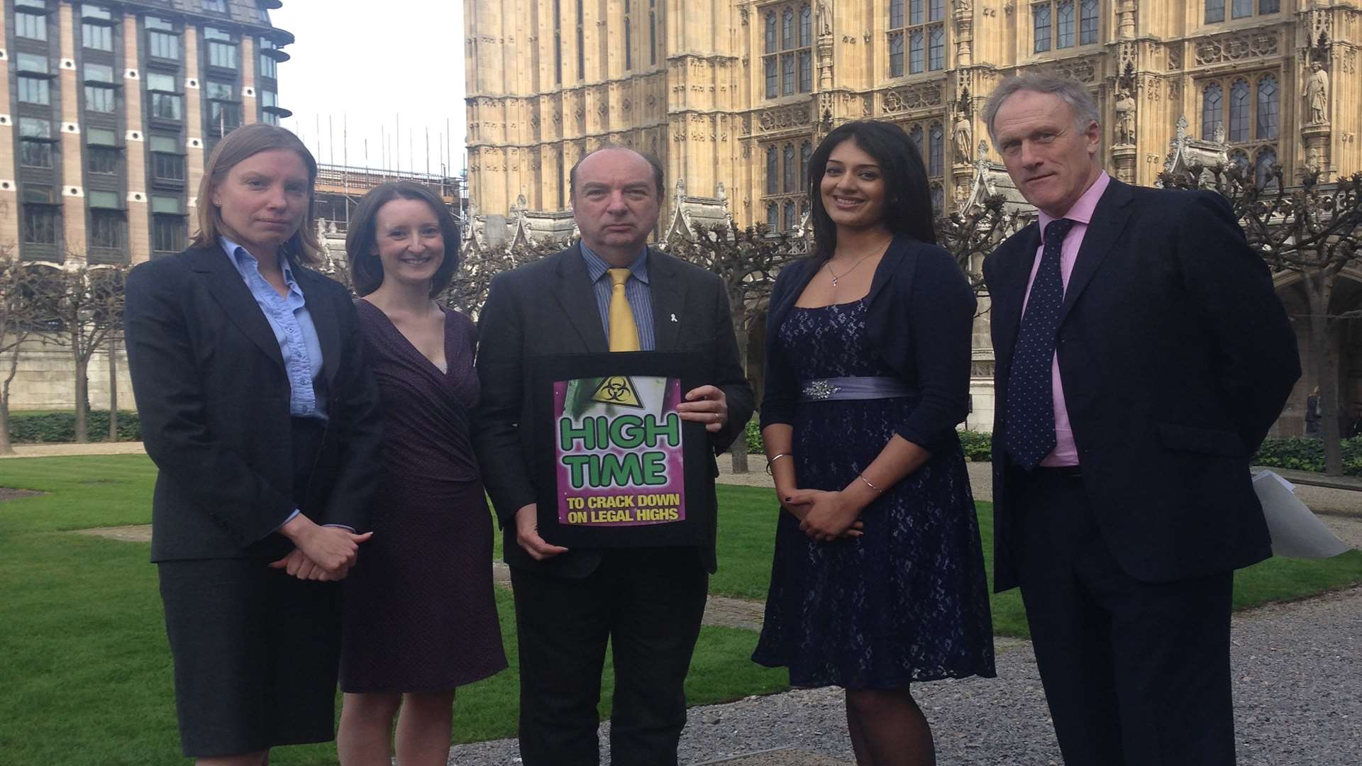 Minister Norman Baker accepts the legal highs dossier from Kiran Kaur and Nicola Everett, together with MPs Julian Brazier and Tracey Crouch
