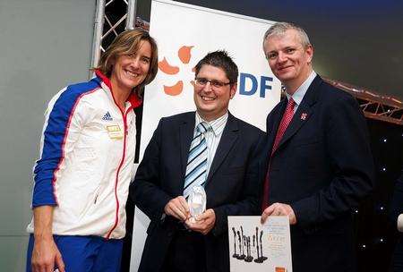 Kentish Gazette and Faversham News editor Leo Whitlock collects Front Page Of The Year award from Gareth Wynn, vaEDF’s group director of the Olympic and Paralympic programme and Olympic rowing silver medalist Katherine Grainger